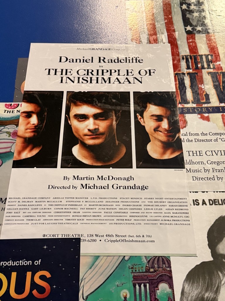 A poster for the play 'The Cripple of Inishmaan' featuring Daniel Radcliffe. The poster includes his name prominently and details about the production, including the director and playwright.